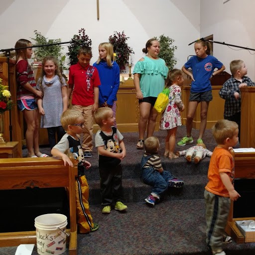 Children singing in worship service